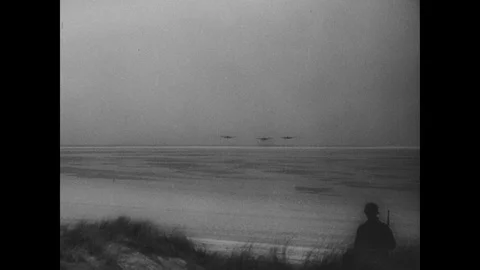 Luftwaffe planes fly over beach Stock Footage 103390169