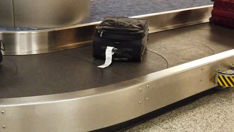Luggage on Baggage Carousel Stock Footage 100380730