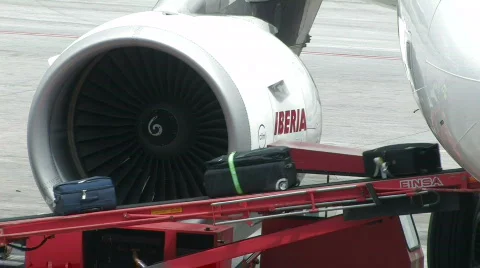 Luggage coming out of plane 1 Stock Footage