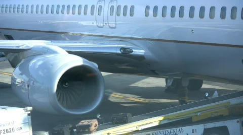 Luggage Loading On A Conveyor Into An Airline Passenger Jet Aircraft Stock Footage
