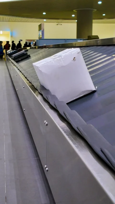 Luggage Moving on Airport Baggage Claim Carousel Conveyor Belt Stock Footage 344087553