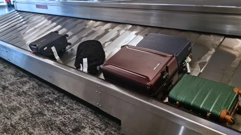 Luggage Moving on Baggage Claim Carousel at International Airport Arrivals 스톡 동영상 340370555