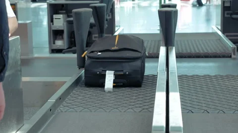 Luggage suitcase getting transported into flight Stock Footage 65531044