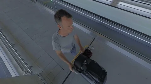 Luggage trolley high angle POV shot at airport pushed by male traveller v2 Stock Footage 118206744