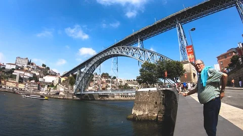 LUIS I BRIDGE DOURO RIVER A MAN AND THE TROLLEY CAR Stock Footage 95093735