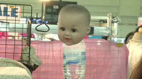 Luk Thep Doll Head on Bottle Stock Footage 65946009