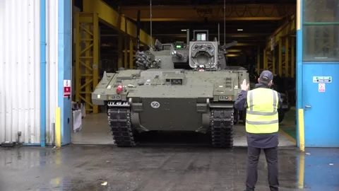 Luke Pollards rides in AJAX AFV during defence visit Stock Footage 320582494