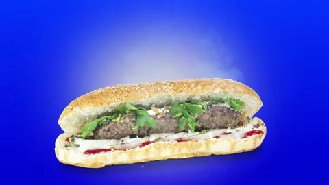 Lule kebab in bread on blue background position from right to center Stock Footage 135072774