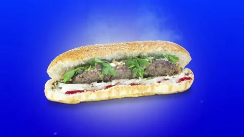 Lule kebab in bread on blue background position from top to center Stock Footage 135072807