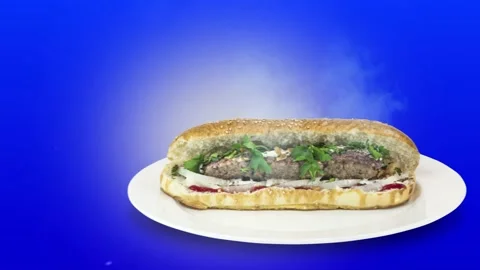 Lule kebab in bread on blue background direction from right to center Stock Footage 135125582