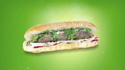 Lule kebab in bread on green background position from top to center Stock Footage 135073080