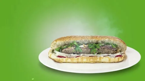 Lule kebab in bread on green background direction from right to center Stock Footage 135126252