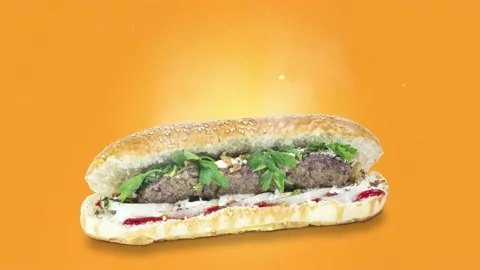 Lule kebab in bread on orange background position from left to center Stock Footage 135078521