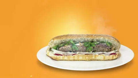 Lule kebab in bread on orange background direction from right to center Stock Footage 135126465