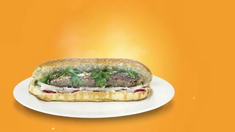 Lule kebab in bread on orange background direction from left to center Stock Footage 135126468