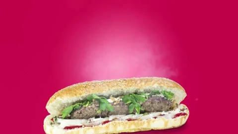 Lule kebab in bread on purple background position from bottom to center Stock Footage 135073095