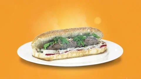Lule kebab in bread on white plate the served with greens, onions, mayonnaise Stock Footage 134453713