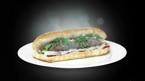 Lule kebab in bread on white plate the served with greens, onions, mayonnaise Stock Footage 134471037