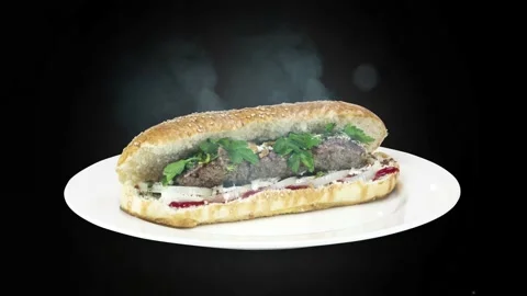 Lule kebab in bread on white plate the served with greens, onions, mayonnaise Stock Footage 134471043