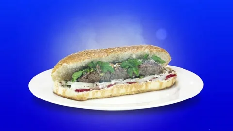 Lule kebab in bread on white plate the served with greens, onions, mayonnaise Stock Footage 134471085