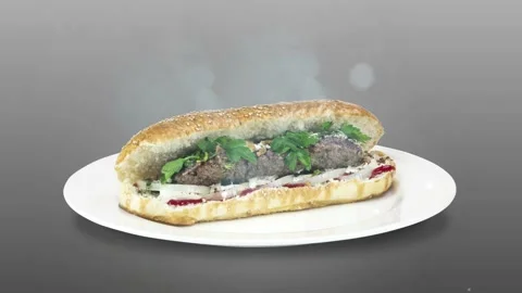 Lule kebab in bread on white plate the served with greens, onions, mayonnaise Stock Footage 134471340