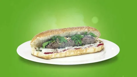Lule kebab in bread on white plate the served with greens, onions, mayonnaise Stock Footage 134471370
