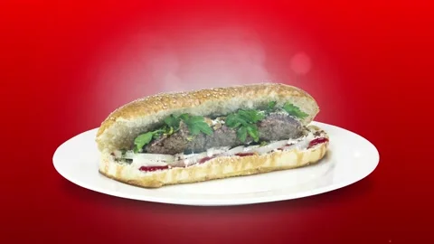 Lule kebab in bread on white plate the served with greens, onions, mayonnaise Stock Footage 134471641