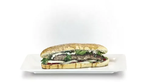 Lule kebab in bread on white plate on white background Stock Footage 135140368
