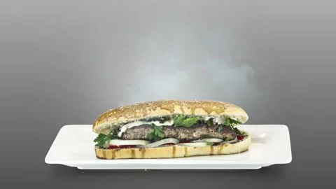 Lule kebab in bread on white plate on gray background Stock Footage 135140650