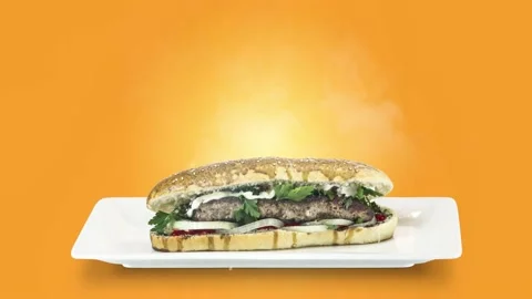 Lule kebab in bread on white plate on orange background Stock Footage 135145886