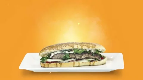 Lule kebab in bread on white plate on orange background Stock Footage 135145894