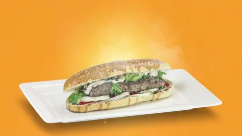 Lule kebab in bread on white plate on orange background Stock Footage 135153442