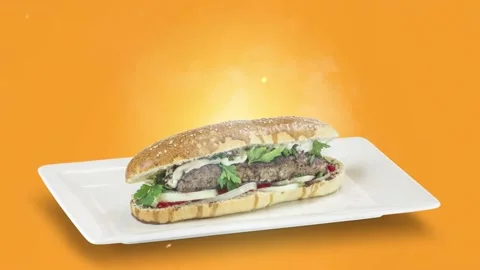 Lule kebab in bread on white plate on orange background Stock Footage 135153452