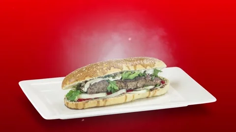 Lule kebab in bread on white plate on red background Stock Footage 135153814