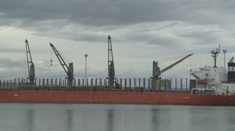 Lumber being loaded on a ship in time lapse Stock Footage 1077089