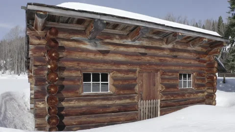 Lumber Log Cabin Snow Cold Environment Winter rotating back shot Stock Footage 145926658