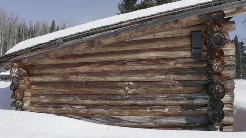 Lumber Log Cabin Snow Cold Environment Winter side shot Stock Footage 145926827