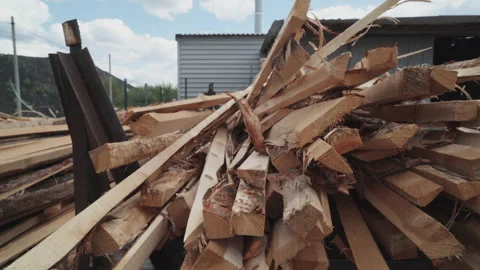 Lumber Scrap Material Pile Unloading For Processing By A Male Worker In Gloves Stock Footage 182027177