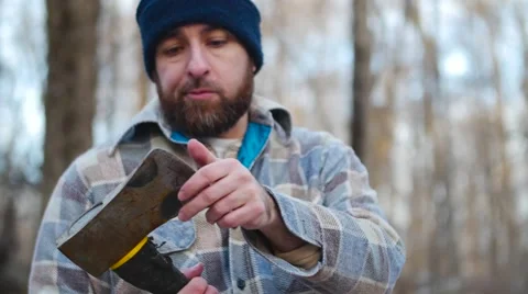 Lumberjack Checks Axe Video stock 58132569