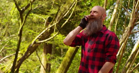 Lumberjack chopping wood for winter Stock Footage 154436764