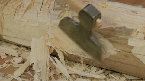 Lumberjack cutting large log with axe at workshop - close up Video stock 233637667