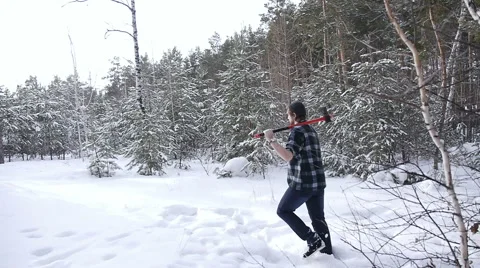 Lumberjack with his ax returns from work of the winter forest Stock Footage 60050942
