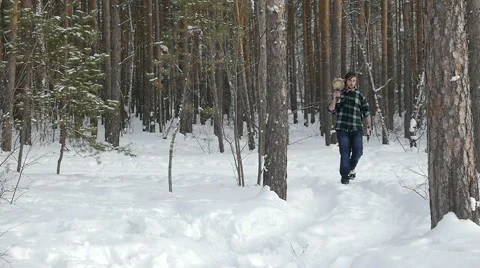 Lumberjack with his ax returns from work of the winter forest Stock Footage 60057359
