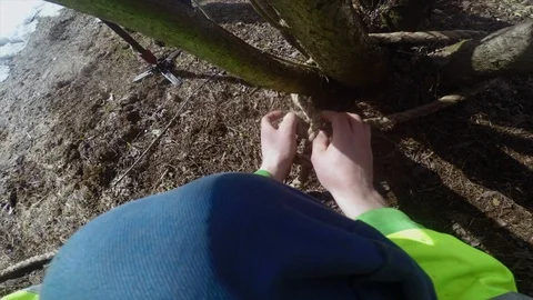 Lumberjack secures insurance to points of support POV Stock Footage 97408286