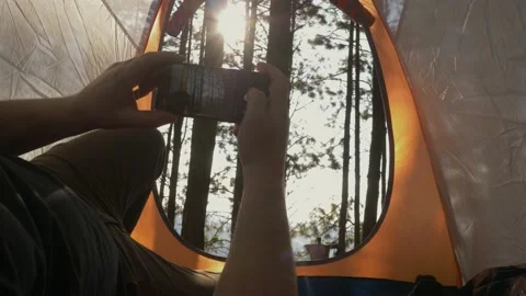Lumberjack setting up camping and chopping firewood Stock Footage 162514805
