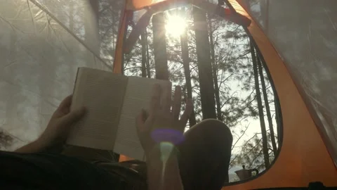 Lumberjack setting up camping and chopping firewood Stock Footage 162514955
