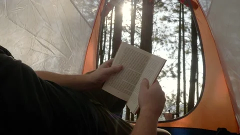 Lumberjack setting up camping and chopping firewood Stock Footage 162514982