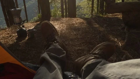 Lumberjack setting up camping and chopping firewood Stock Footage 162515584