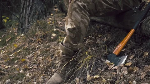 Lumberjack sitting in the forest .Resting after hard work. Vídeo Stock 81113202