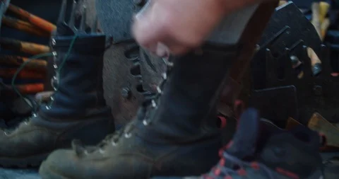 Lumberjack ties boots before going to work Stock-Footage 110921558